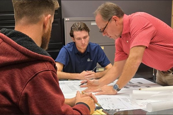 lucido-and-associates-steven-garrett-and-two-employees-working-on-a-landscape-architecture-project-in-conference-room